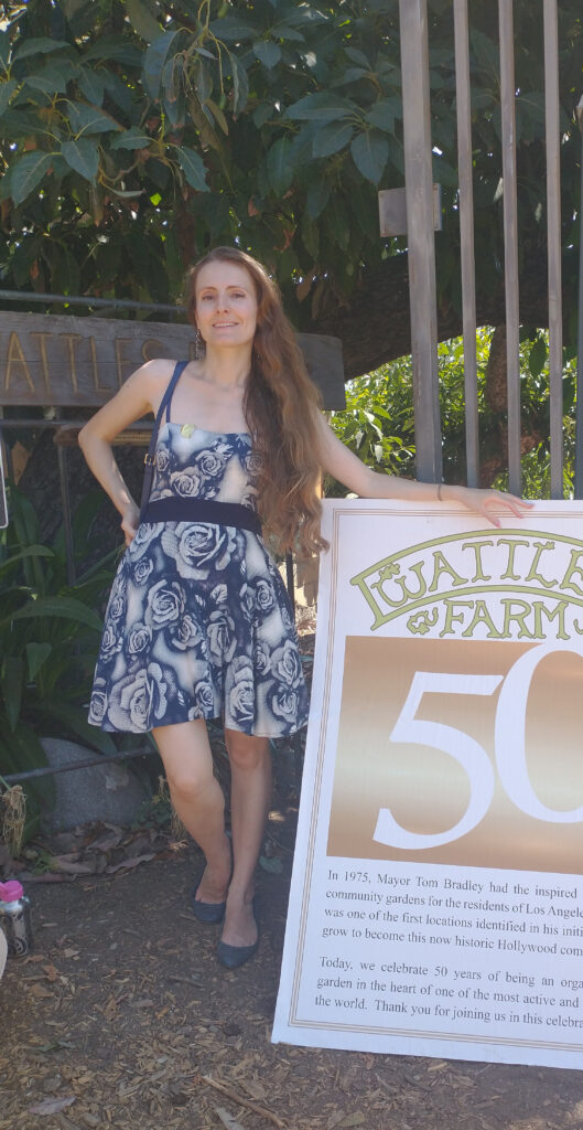 Alexis aka Alina in front of Wattles 50th sign 